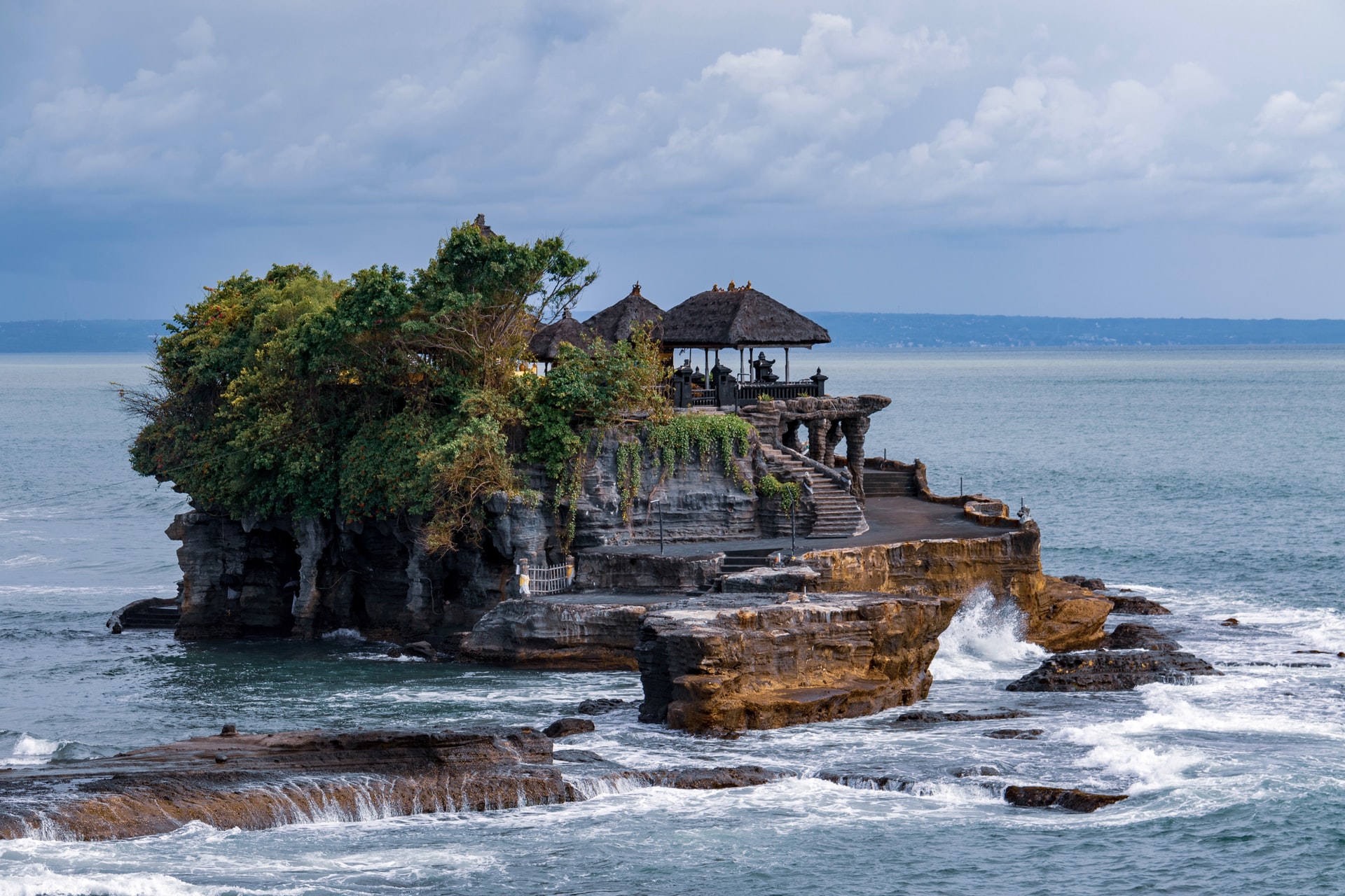 When it comes to things to do in Bali, its natural beauty rightly takes a place. When you have a Bali holiday travel around because the archipelago has much to offer. Tanah Lot is an offshore rock formation with a temple. Bali images that tourists want should include this attraction 13 kilometres south of Tabanan. As you approach this scenic spot, souvenir shopkeepers are after your money. It is worth the walk past them to reach Tanah Lot. Who knows, you might want to spend some money as well?