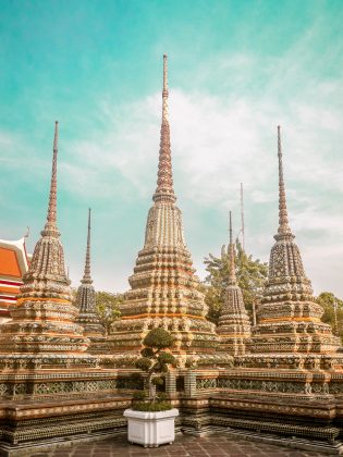 Wat Pho is just down the street from the Grand Palace and is home to a giant reclining Buddha that is 150 feet long and covered in gold leaf.