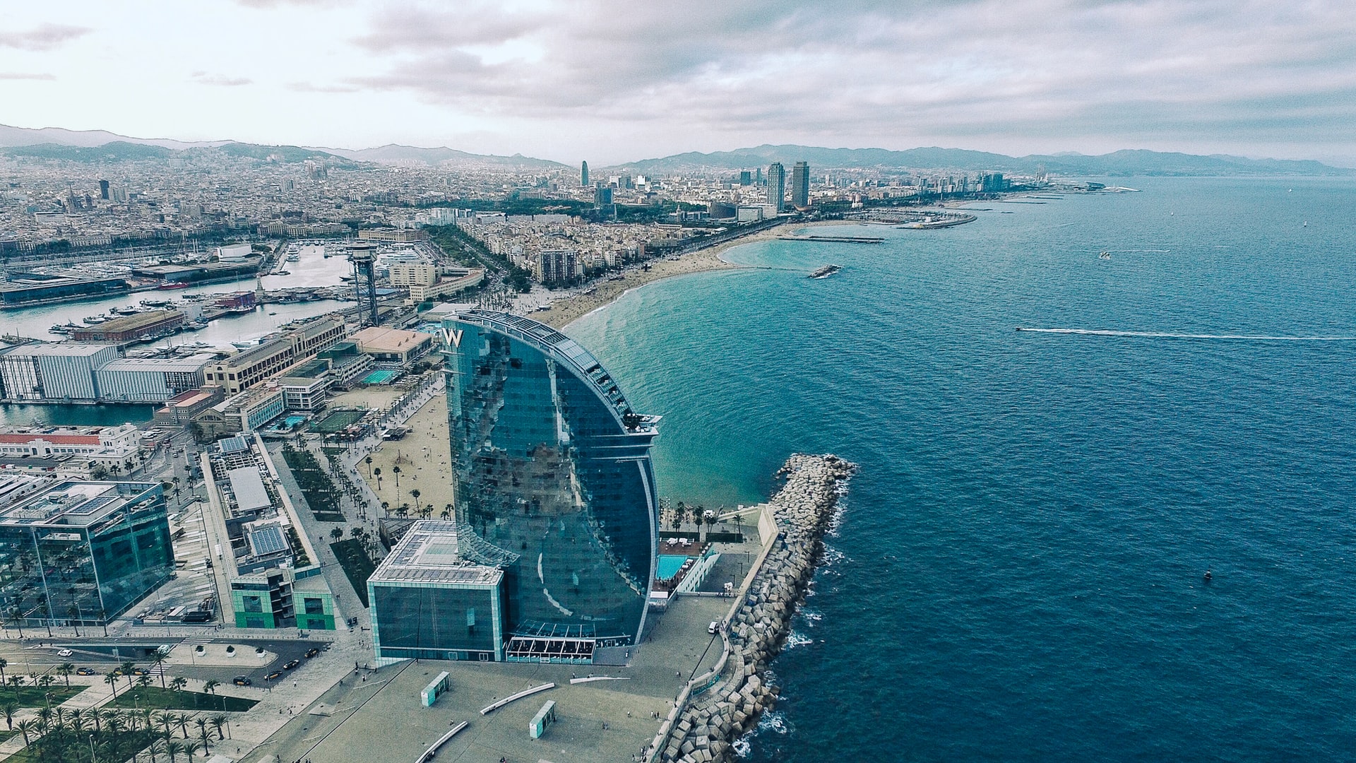There are many popular districts in Barcelona and the seafront is certainly one of them. La Rambla is a wide pedestrian avenue heading up from the seafront which attracts huge numbers day or night. It has cafes, restaurants and bars, hotels, street performers and a wonderful covered market, La Boqueira.