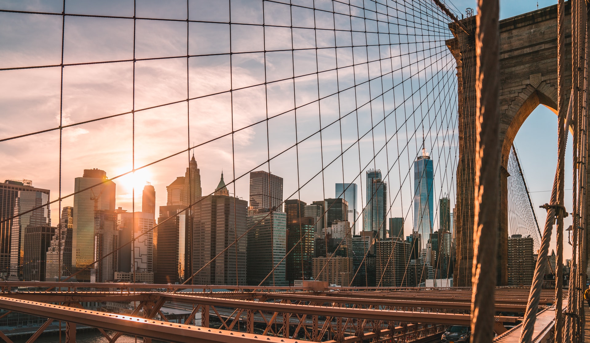 Brooklyn Bridge is another famous structure found in New York City. It’s one of the many bridges that connect both sides of the city. It spans the width of the large Hudson River at 1,834m. In particular, this shot features the city’s many skyscrapers with a warm sun hiding right behind them. Though you won’t be able to see all of New York’s wonders from here, such as Long Island City, it’s still a great view nonetheless.