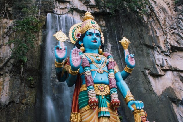Once you get to Batu Caves, you will be greeted by a gold, 140-feet statue of Murugan next to 272 colorful steps.