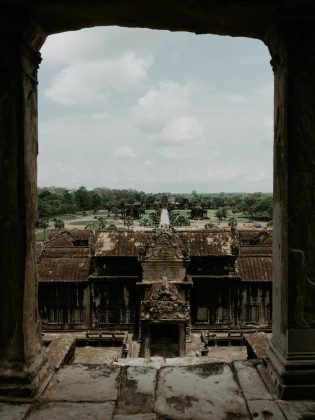 Many people visit Angkor Wat to see the sunrise as it rises behind the temple, offering a stunning view.