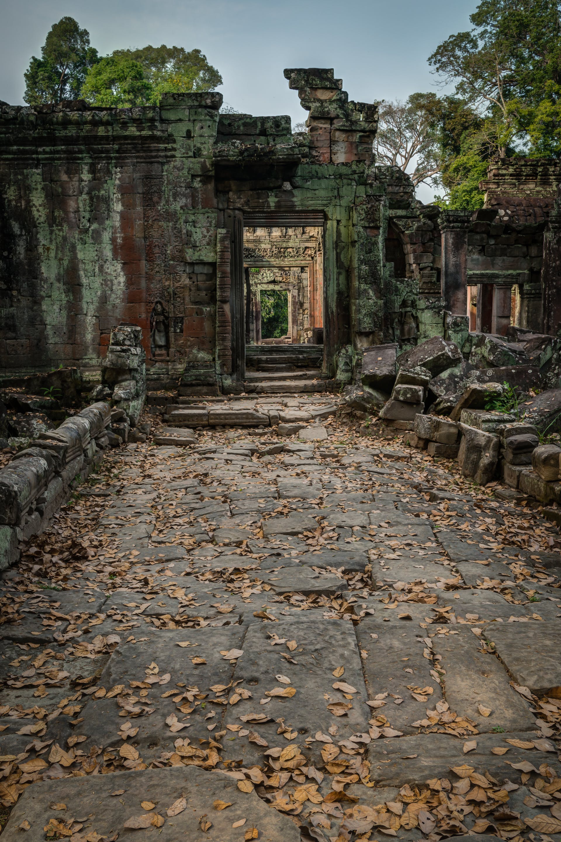 Stone faces are built into the structure smiling back at visitors.