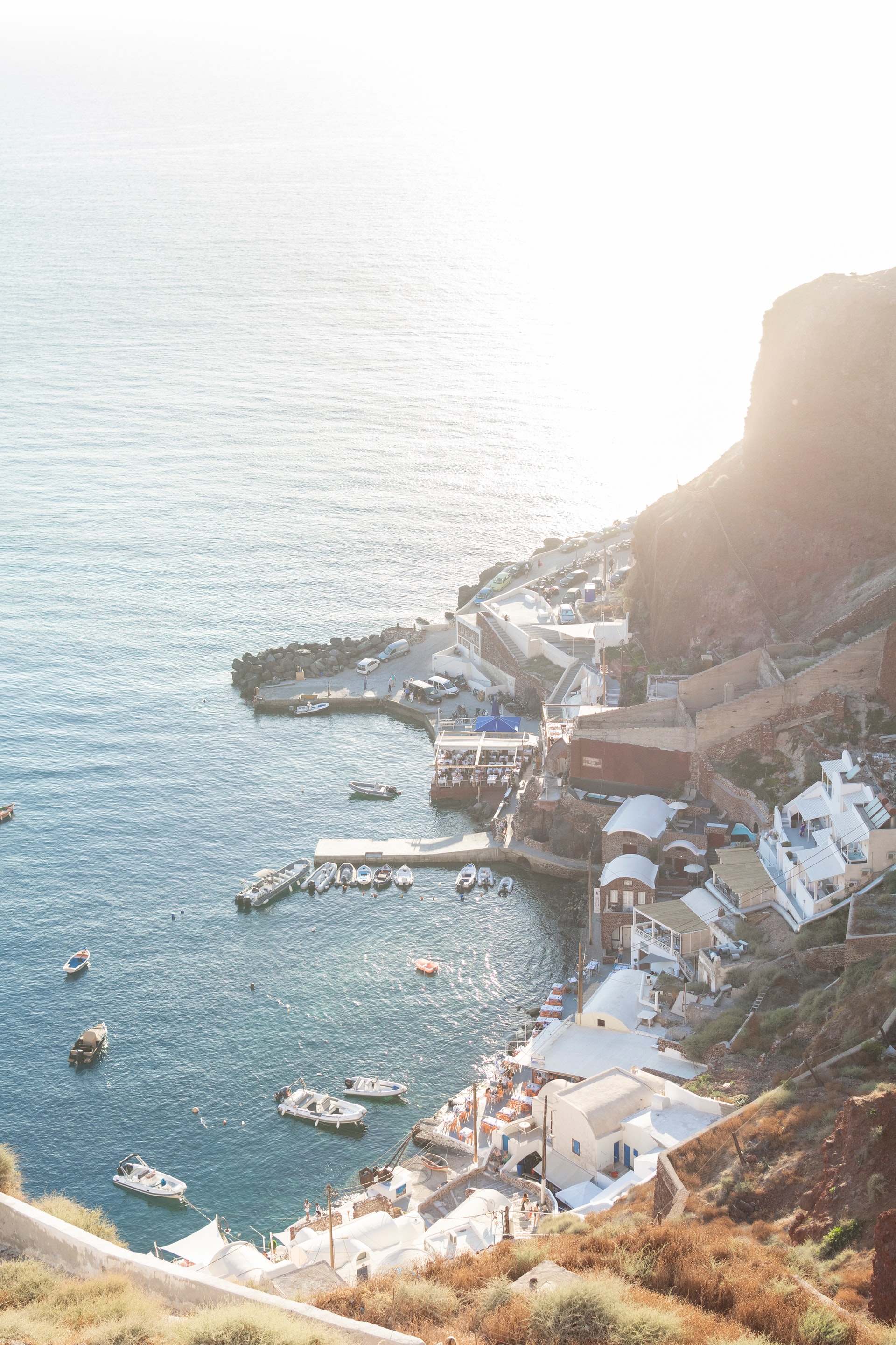 This beautiful bay is 200 steps below Oia. There is the small port looking out on the bay from which you catch a ferry or take a day cruise on the Aegean. Heading out to sea by day is something that you should certainly do during your Santorini holiday. There are small islands to explore very closeby.